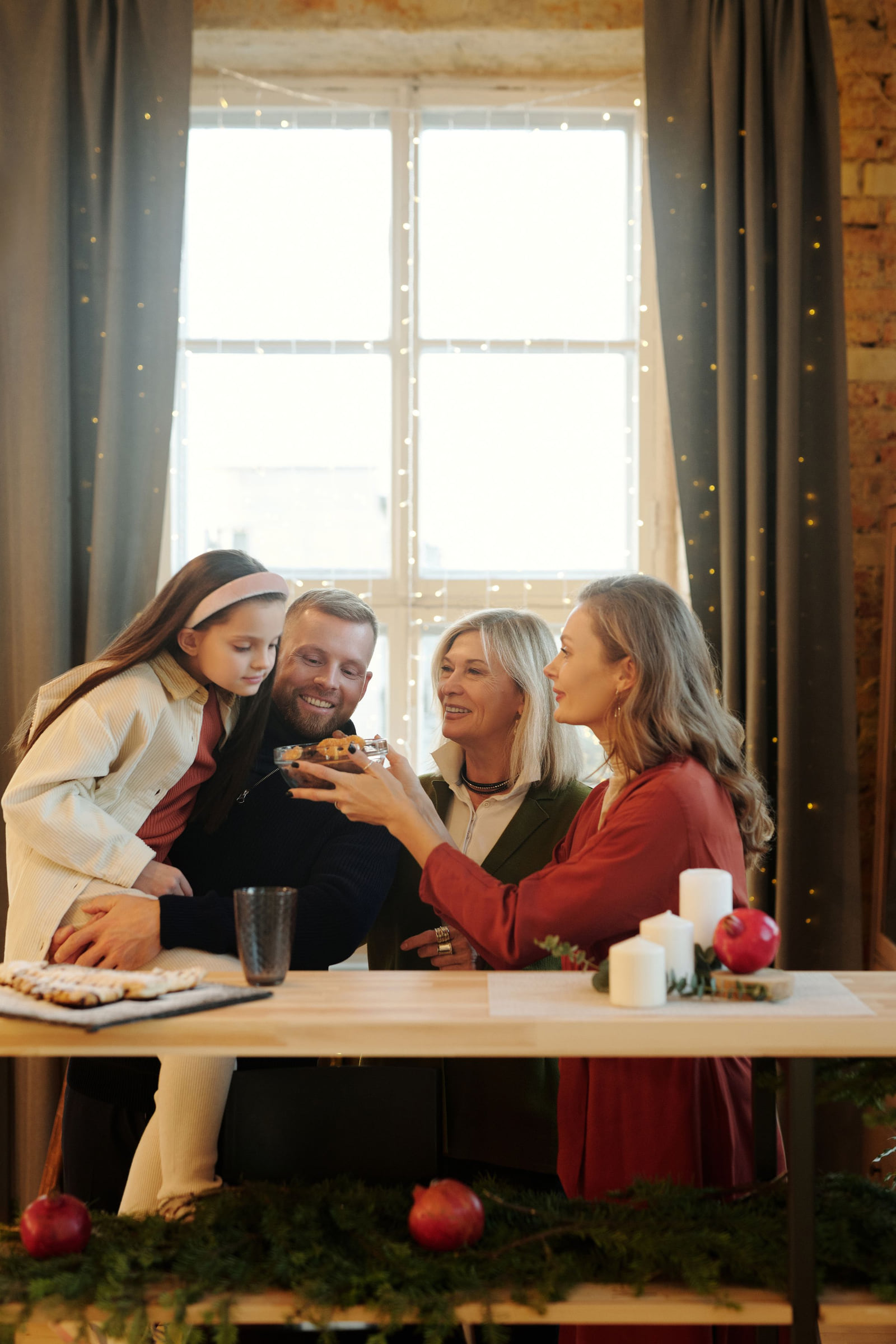 Family members gathered around a table during a holiday celebration.