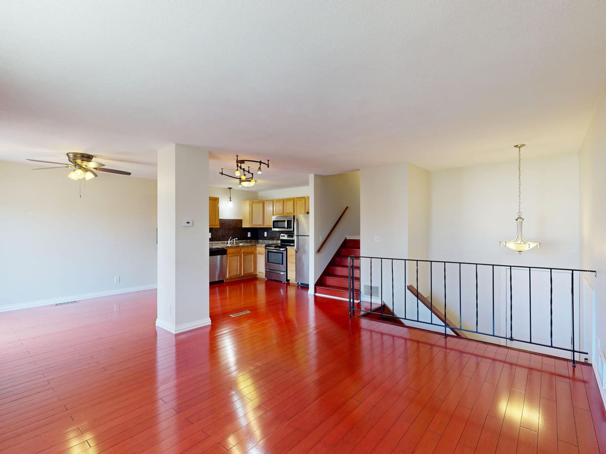 A bright renovated interior with polished wooden floors.