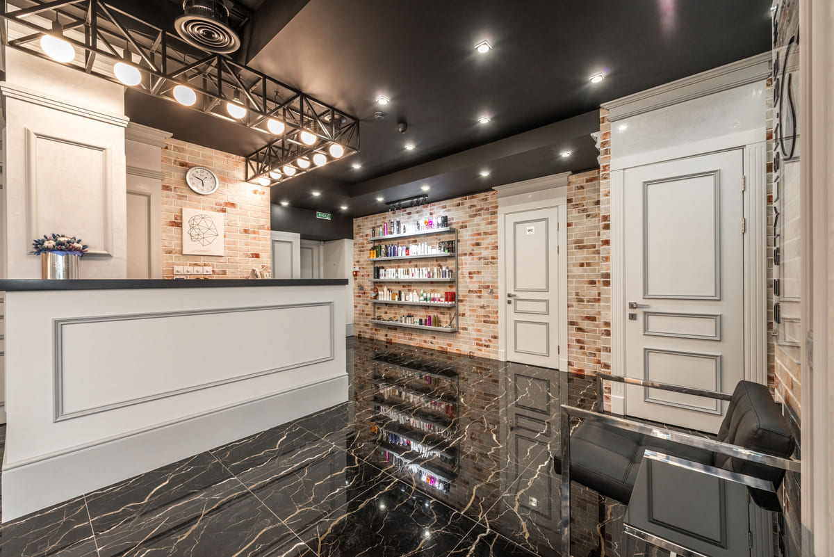 The reception area of a neatly arranged salon.