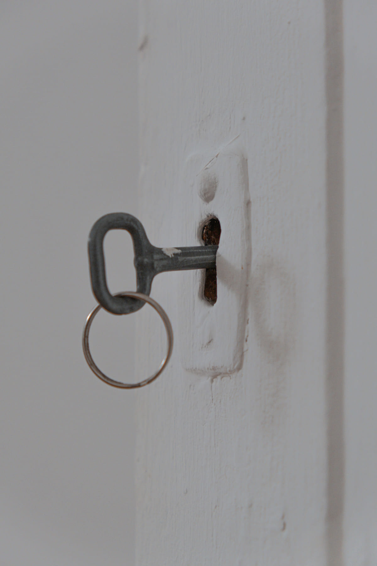 A key inserted into a front-door lock.