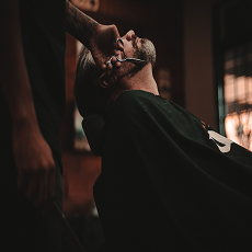 Elam Barber Shop logo